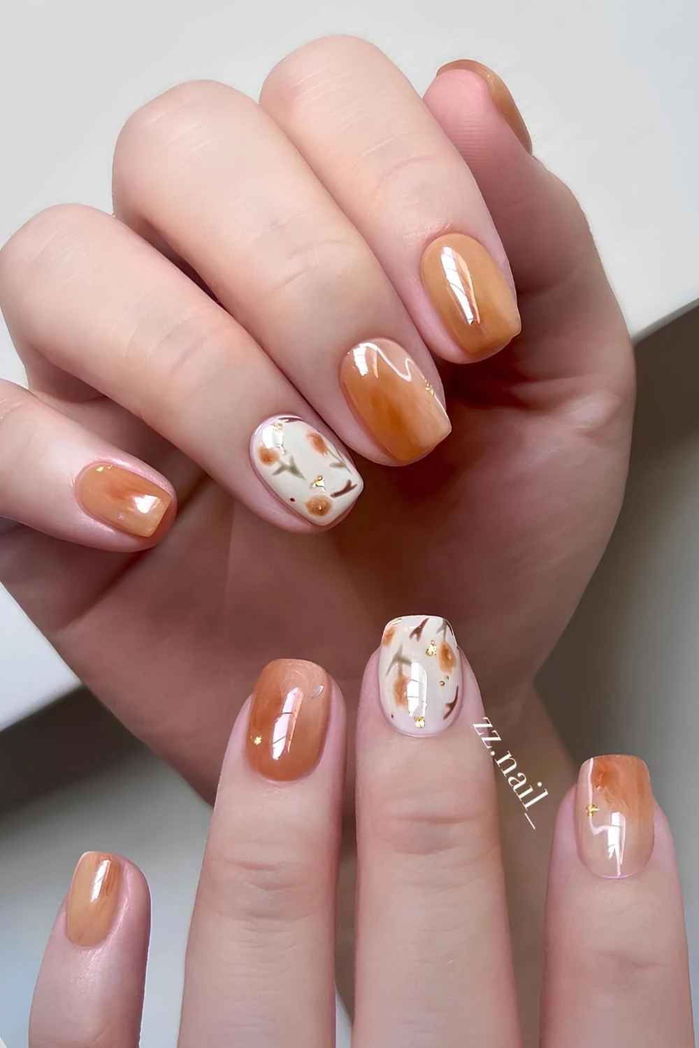 Burnt orange mani with floral art
