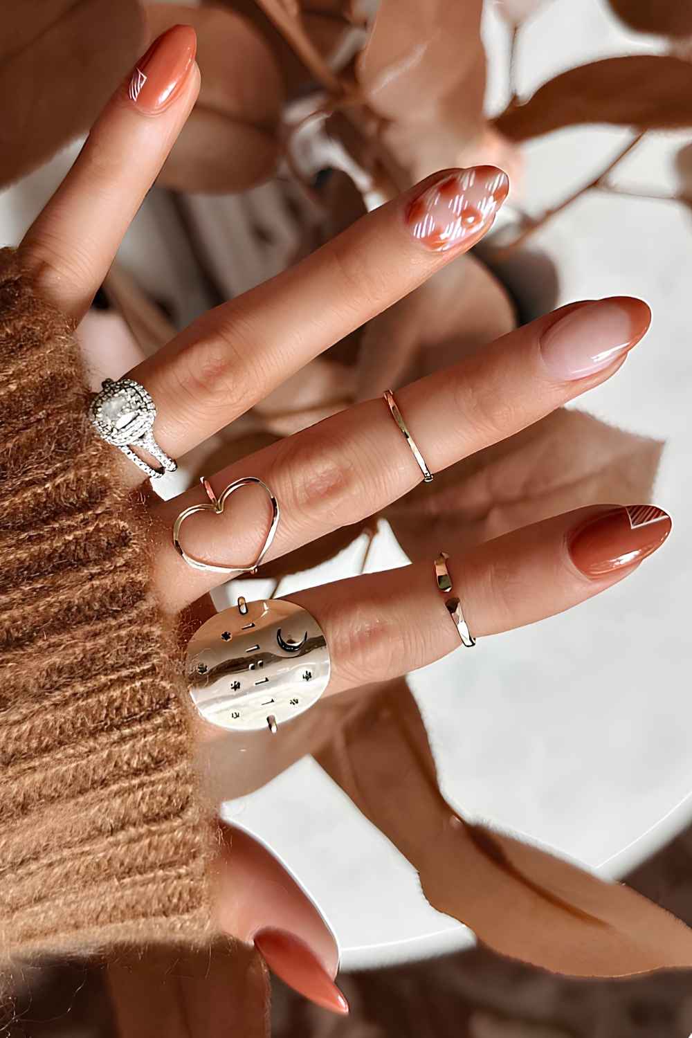 Burnt orange mix and match mani with checkerboards