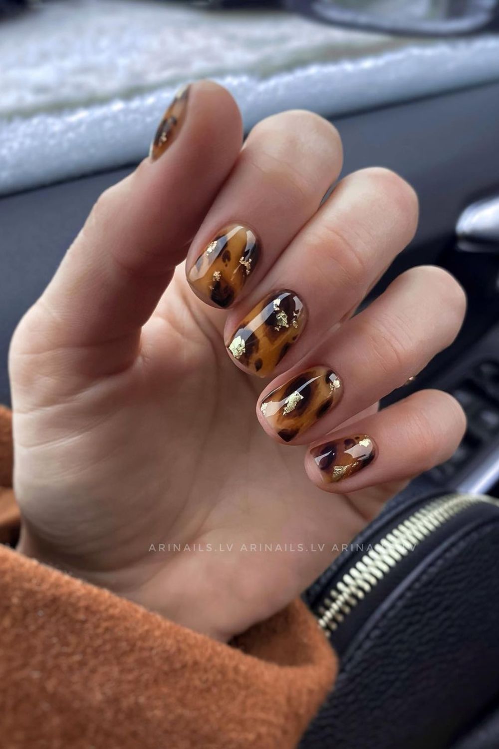 Burnt orange nails with leopard print