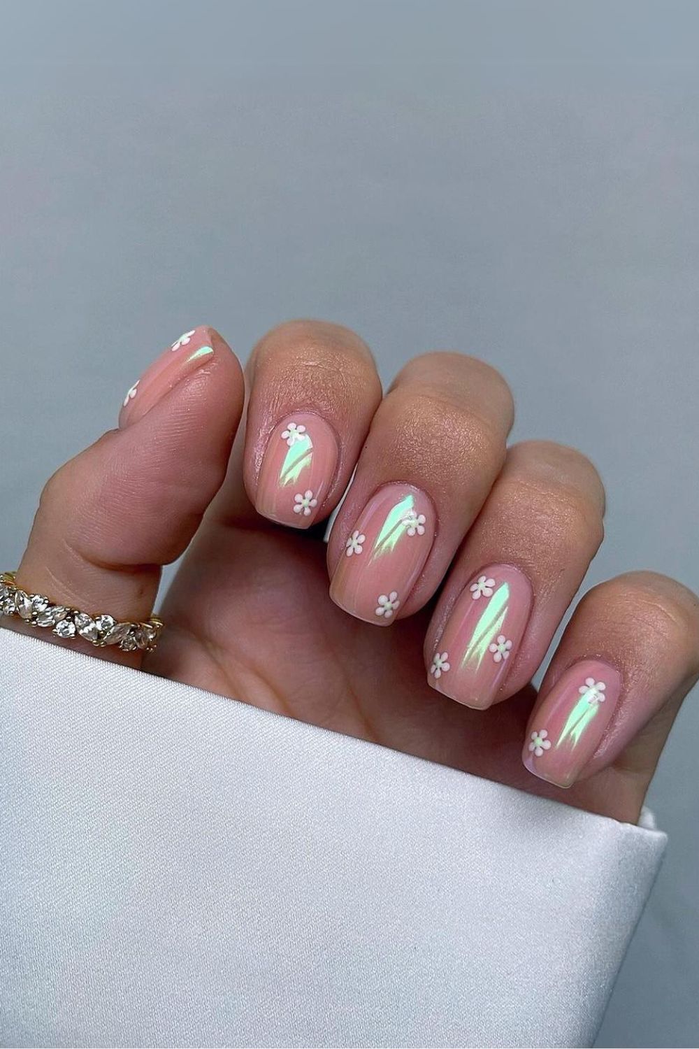 Chrome nails with daisy accents