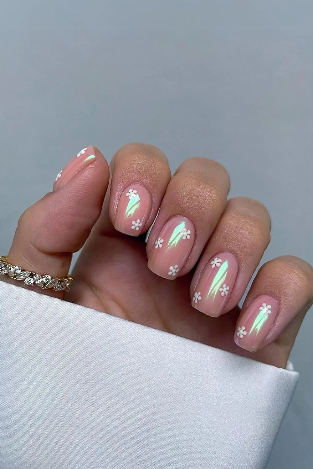 Chrome nails with daisy accents