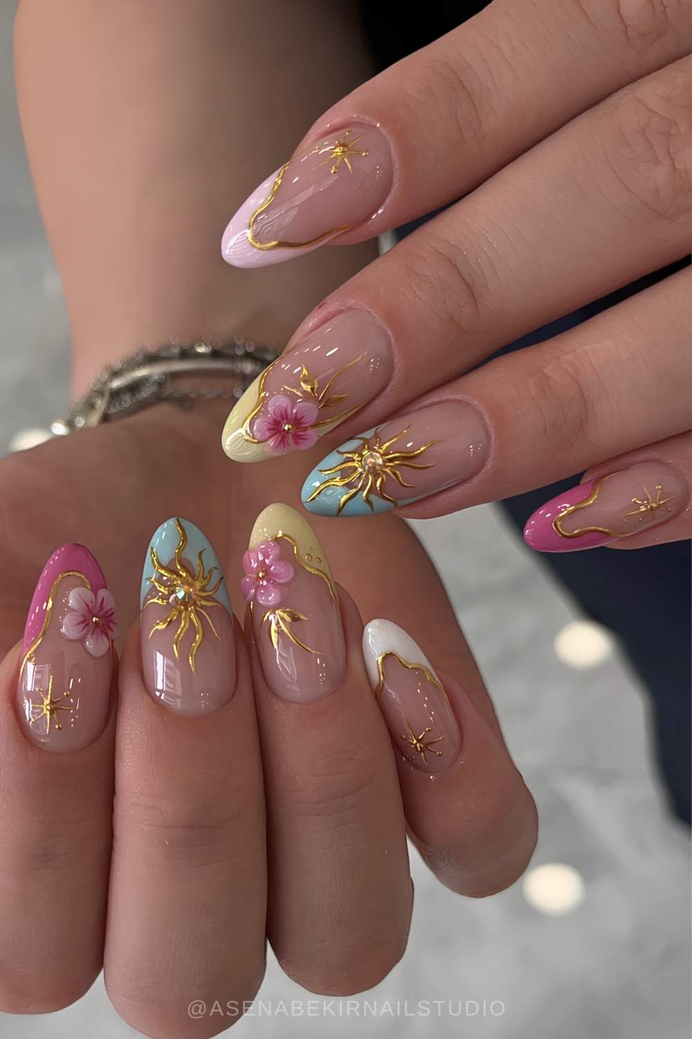 Colorful French mani with celestial art and flowers