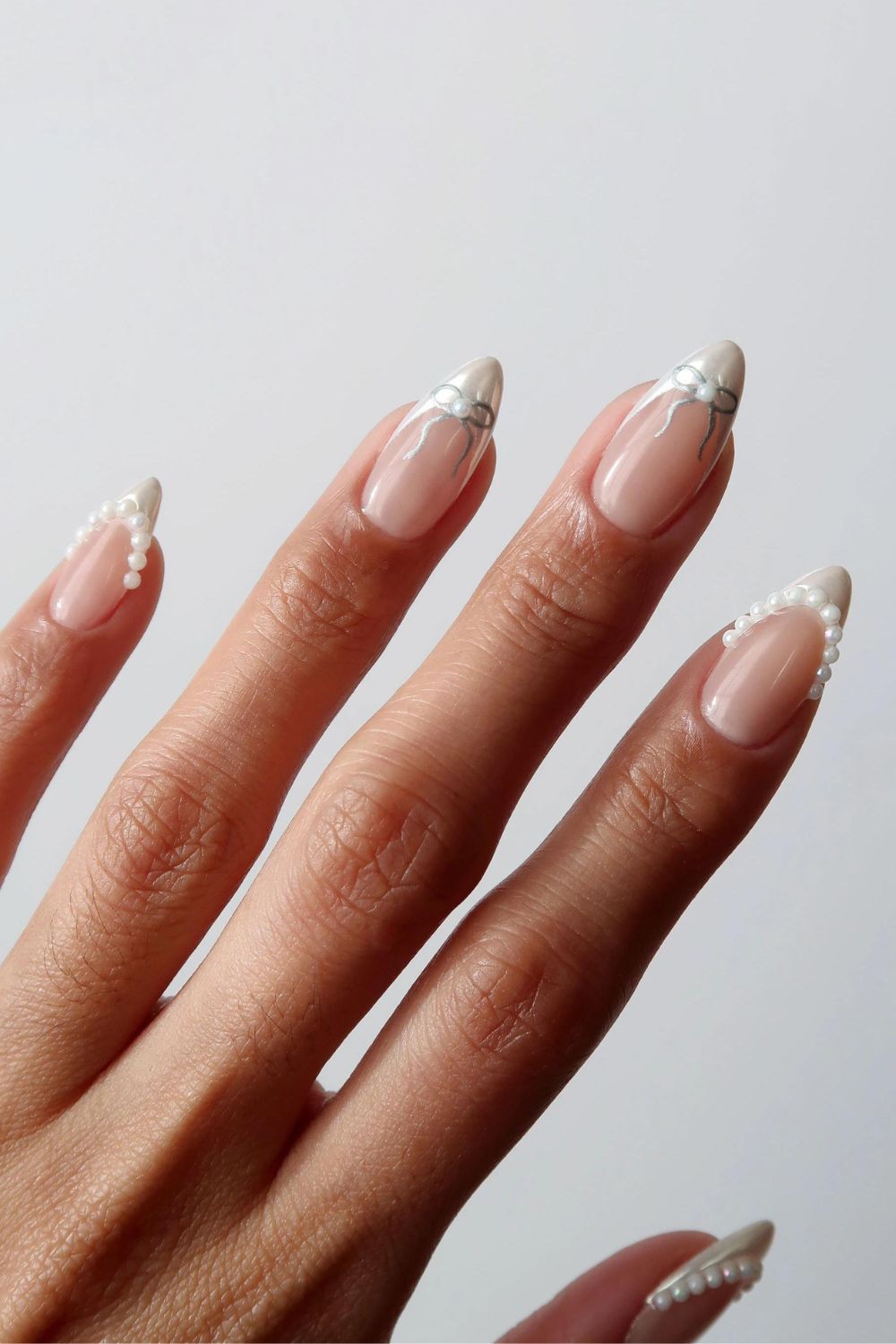 Coquette French tips with pearls and bows