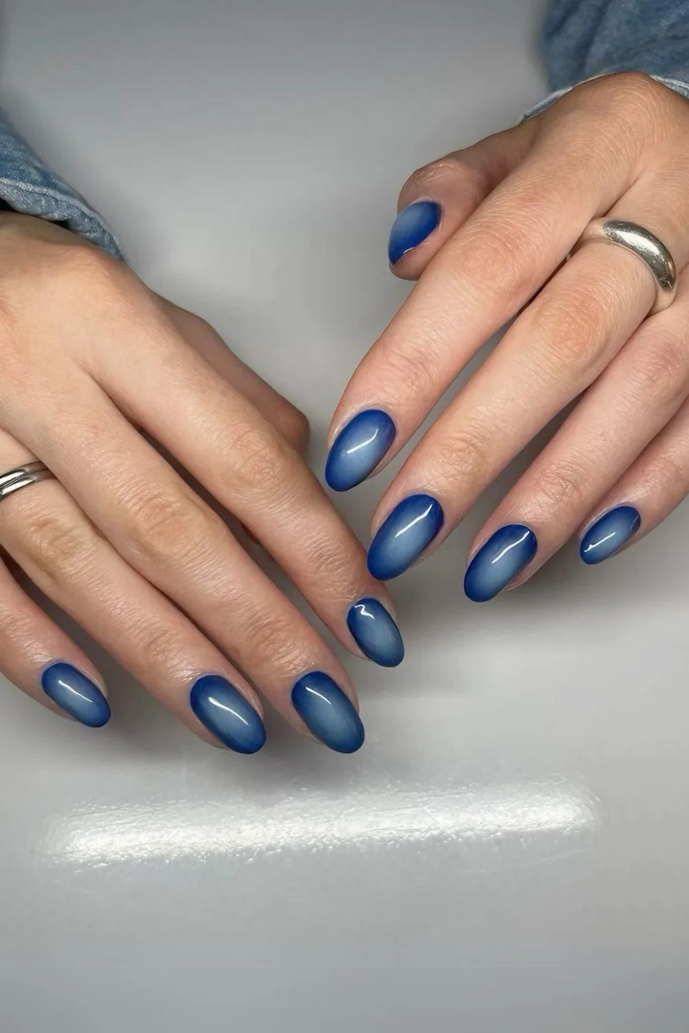 Dark blue aura-effect nail design