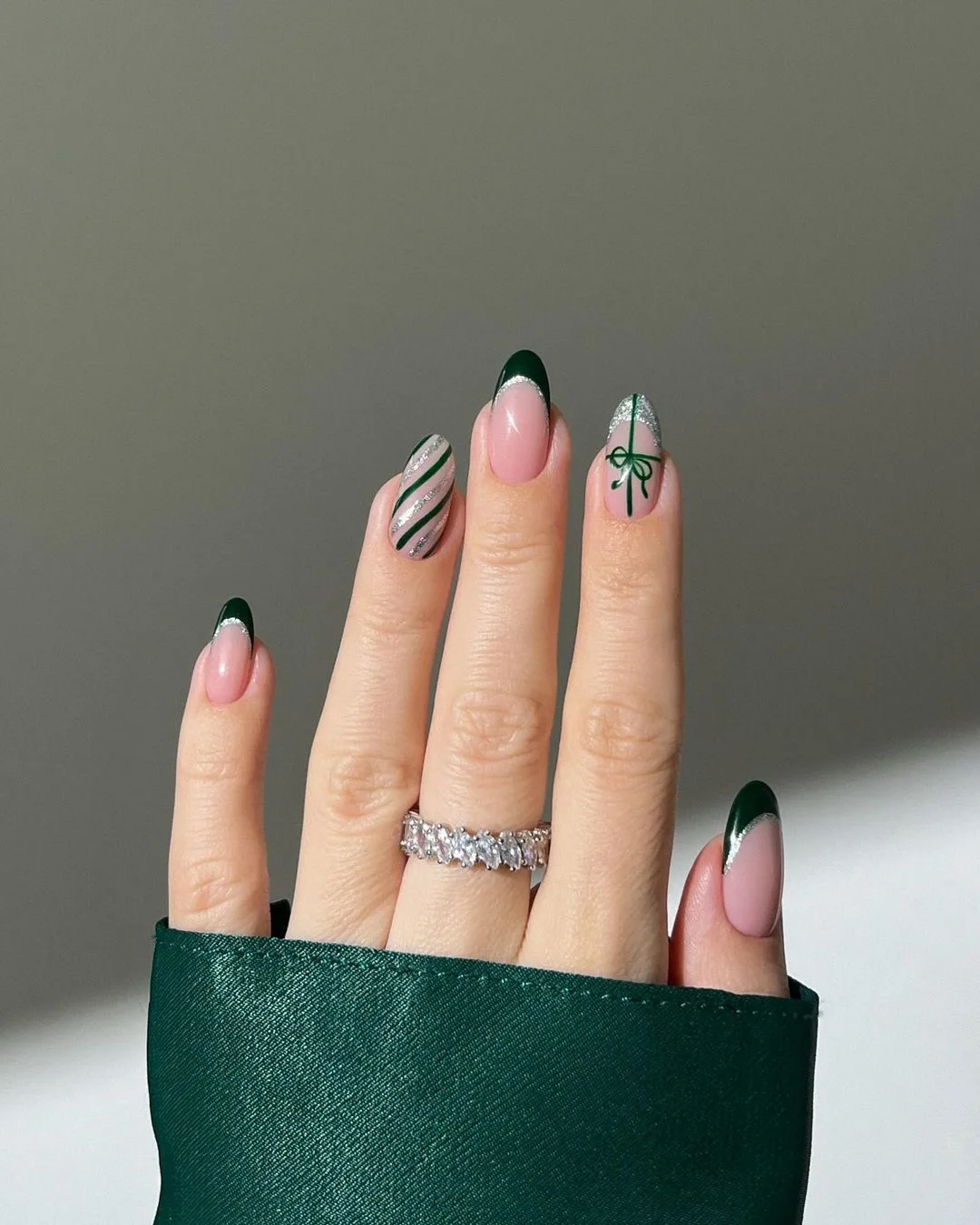 Dark green french mani with gift accent nail