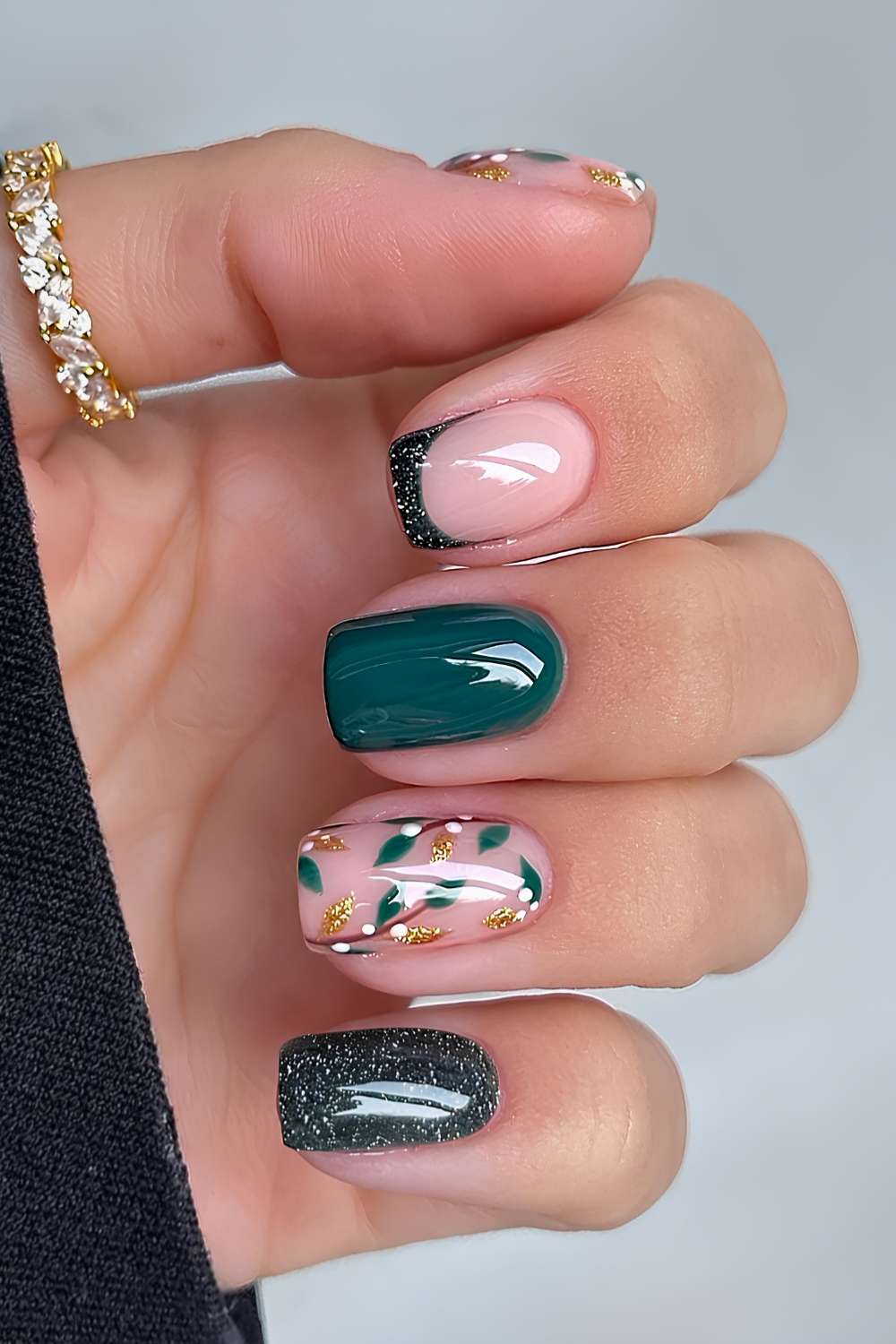 Dark green nails with mistletoe art and glitter