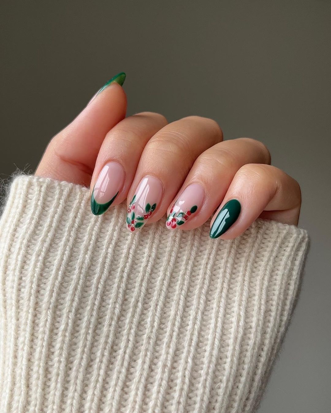 Dark green reen nails with holly accents