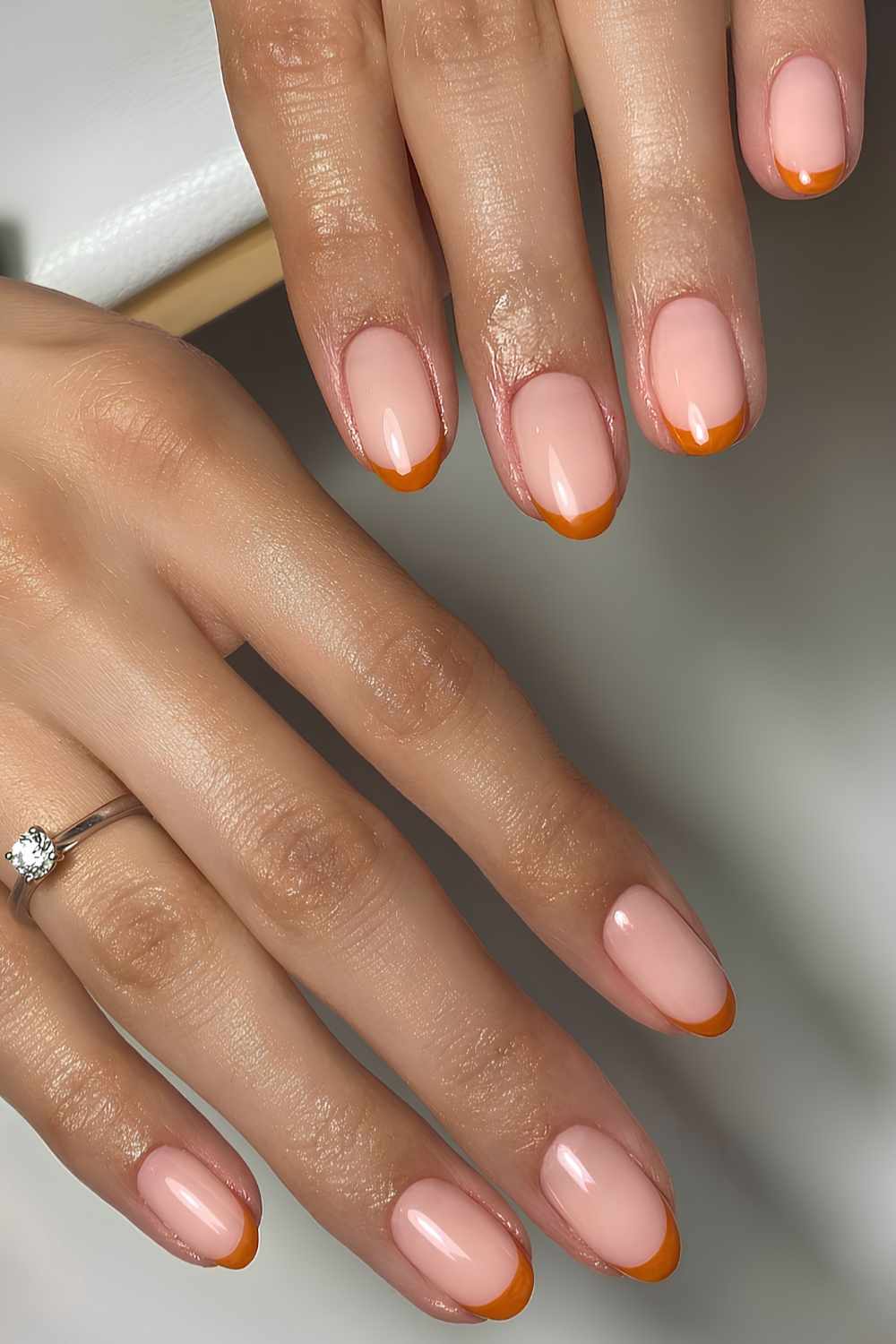Dark orange French tip manicure