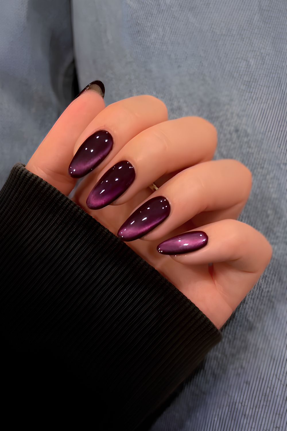 Dark purple cat eye manicure