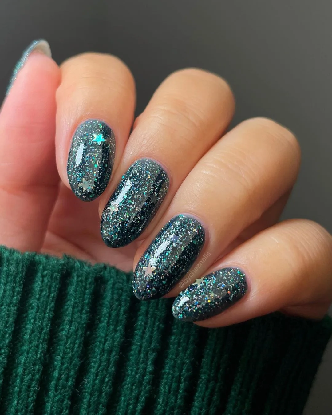 Deep teal holographic glitter nails with stars