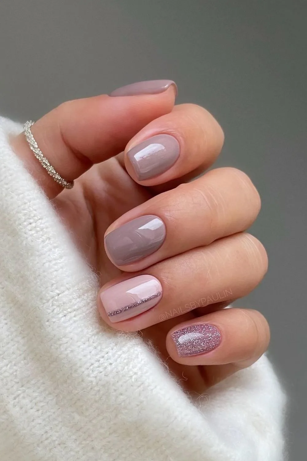 Dusty mauve nails with glitter accents