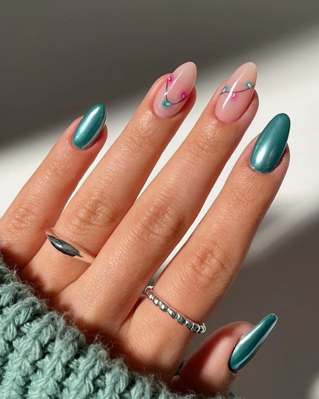 Glazed teal green nails with Christmas lights