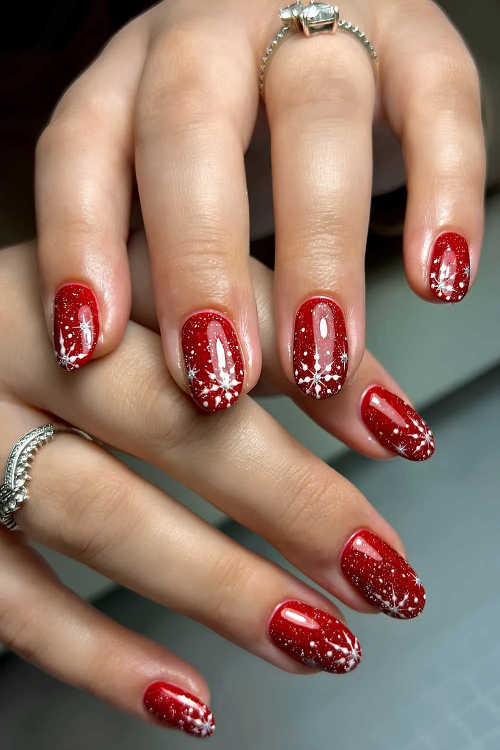 Glittery red manicure with snowflakes