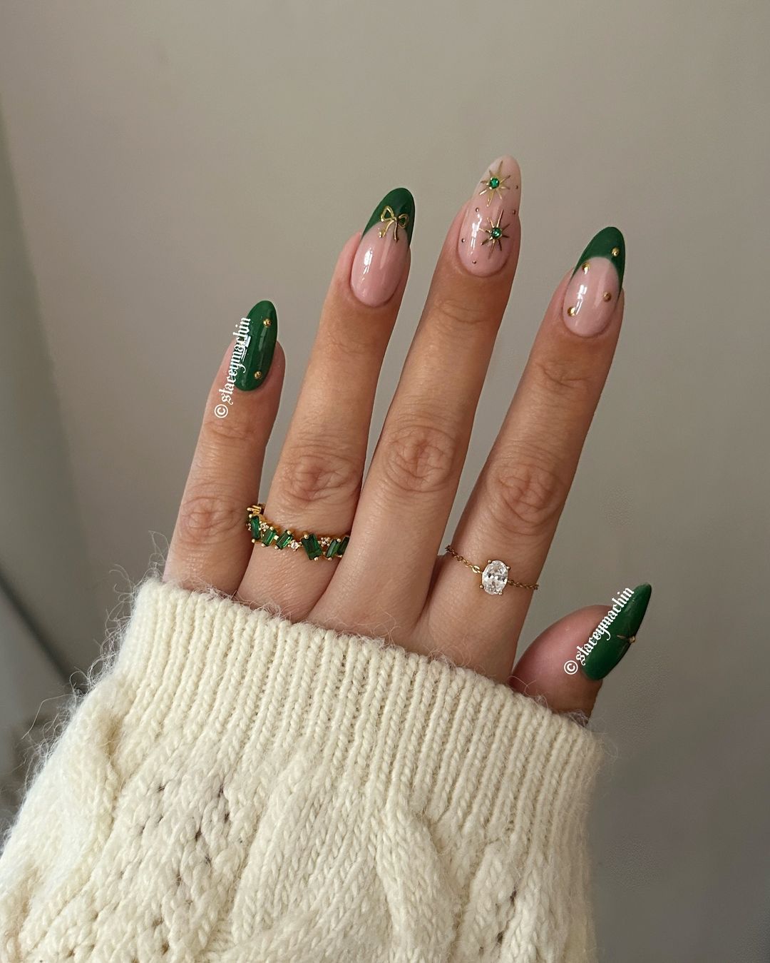 Green Christmas nails with gold celestial, dot and bow accents