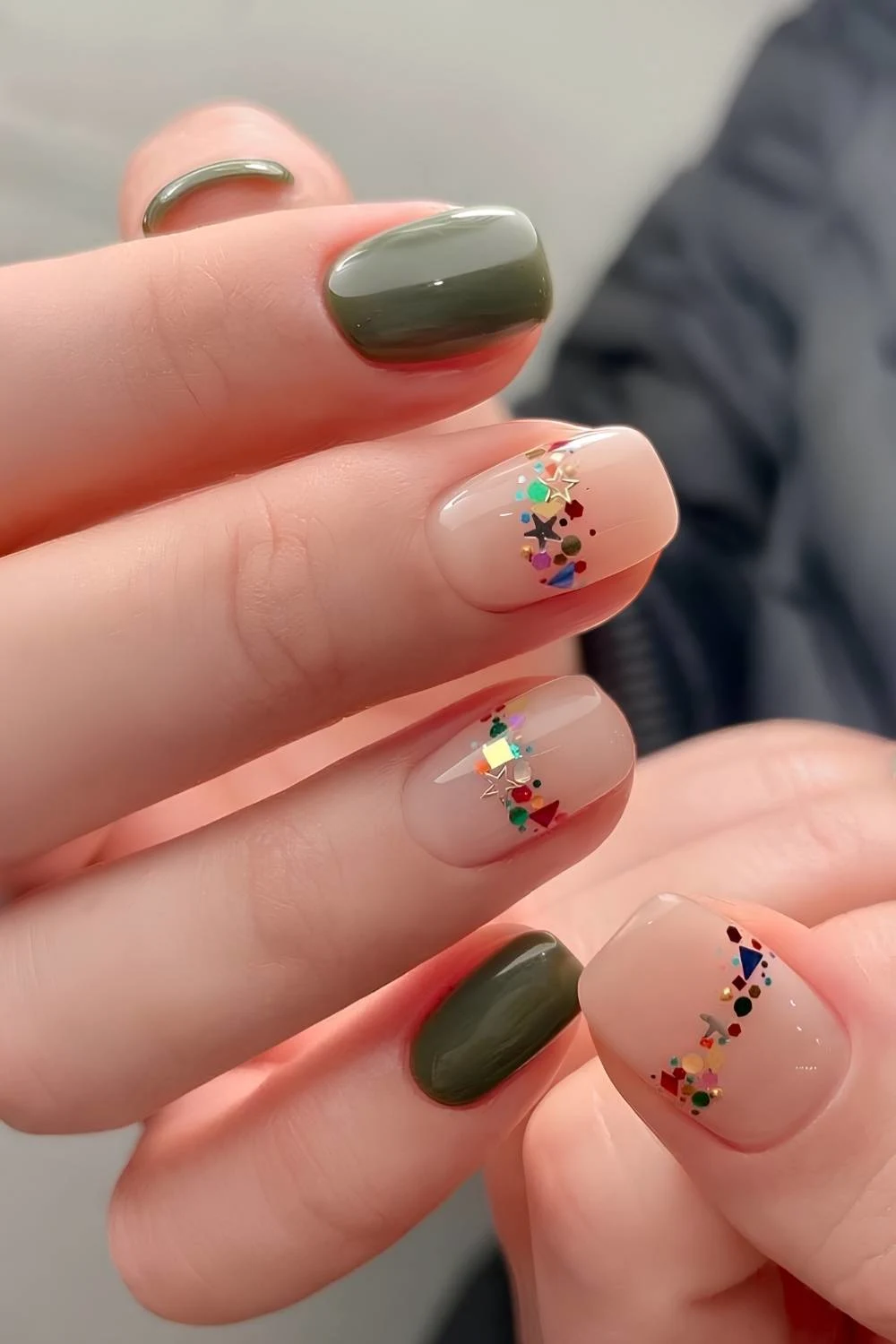 Green nails with chunky glitter accent