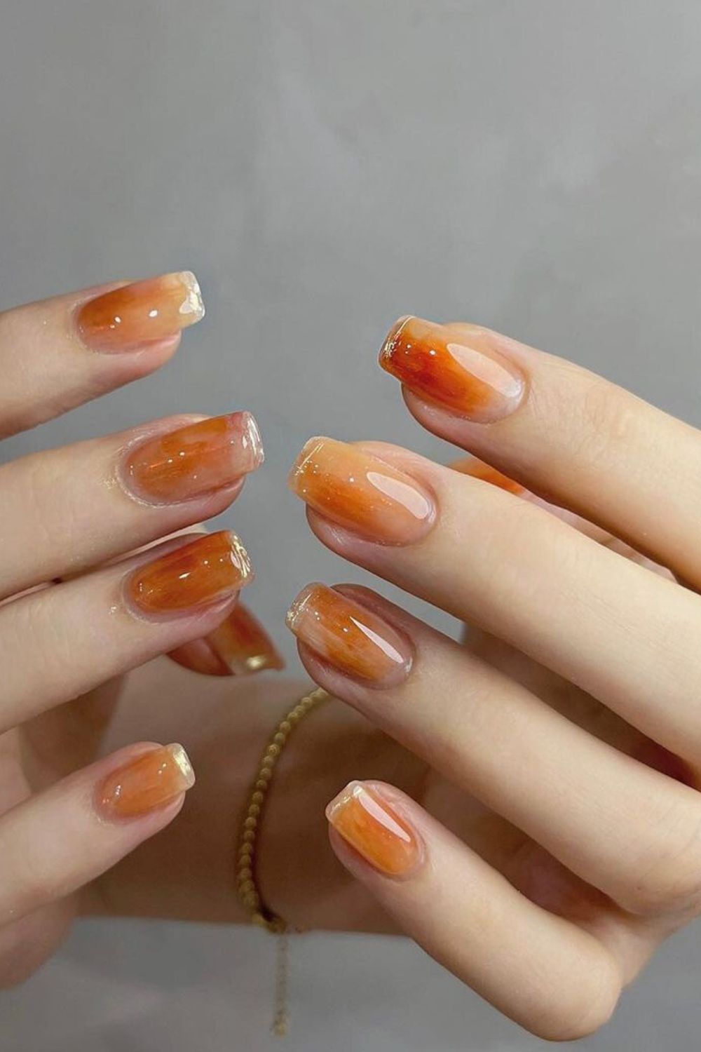 Honey orange marble nails