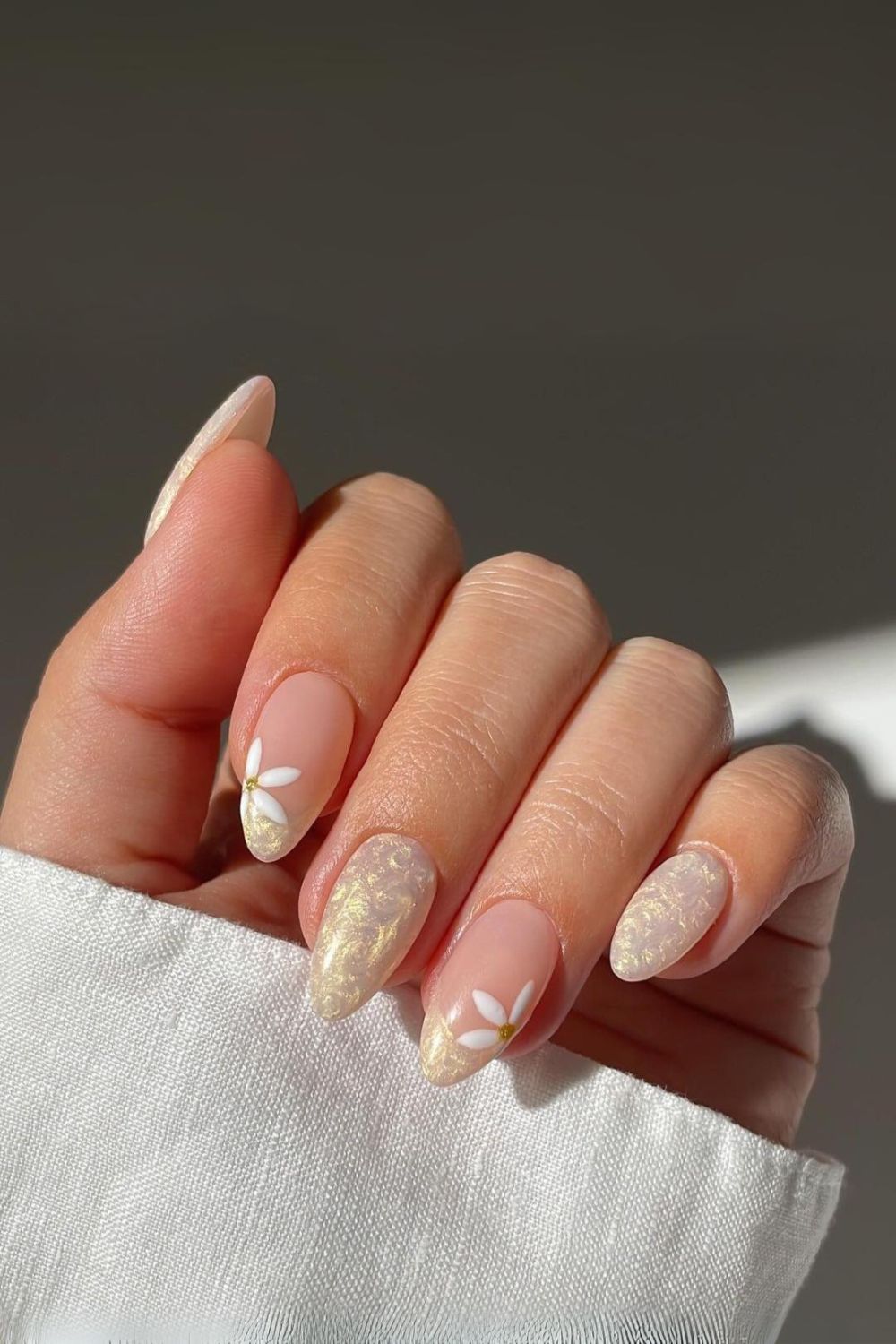 Ivory pearl nails with daisy accents