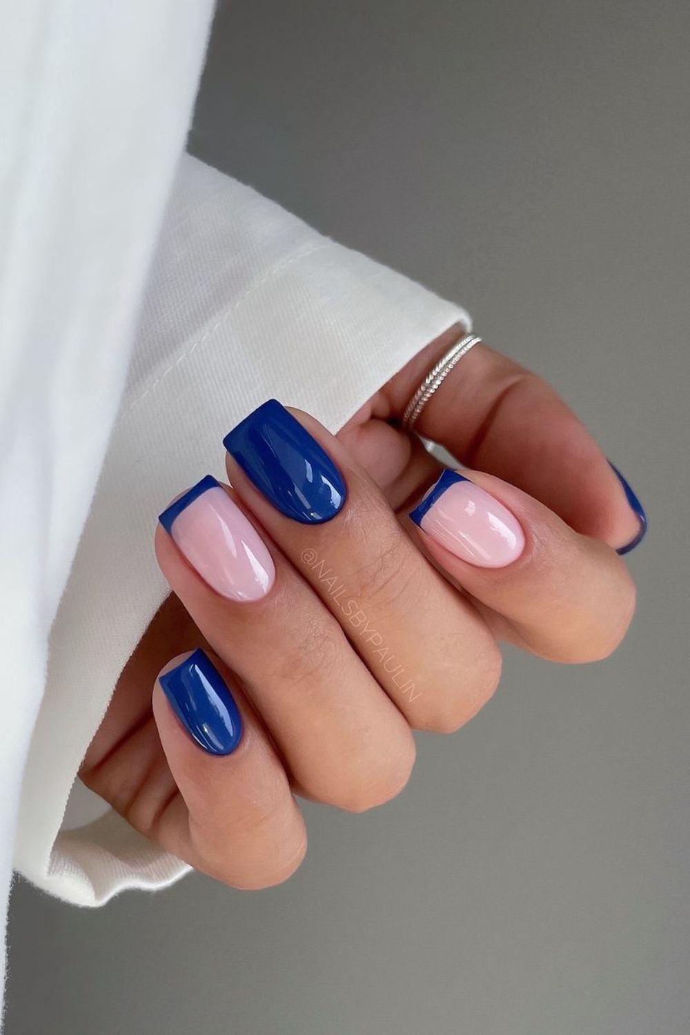 Lapis blue nails with thin french accent tips