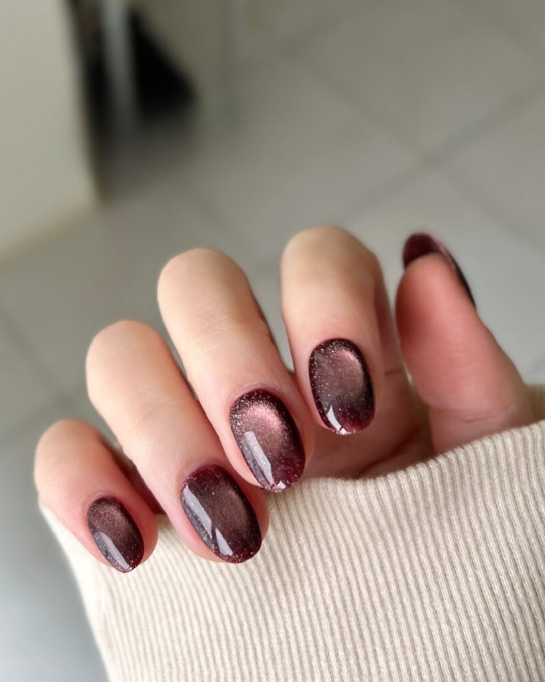 Maroon cat eye nails