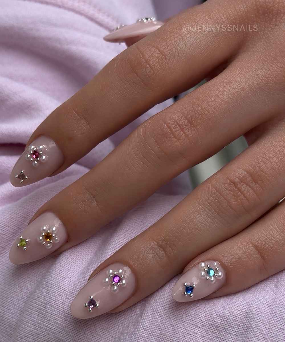 Milky mani with pearl and gem flowers