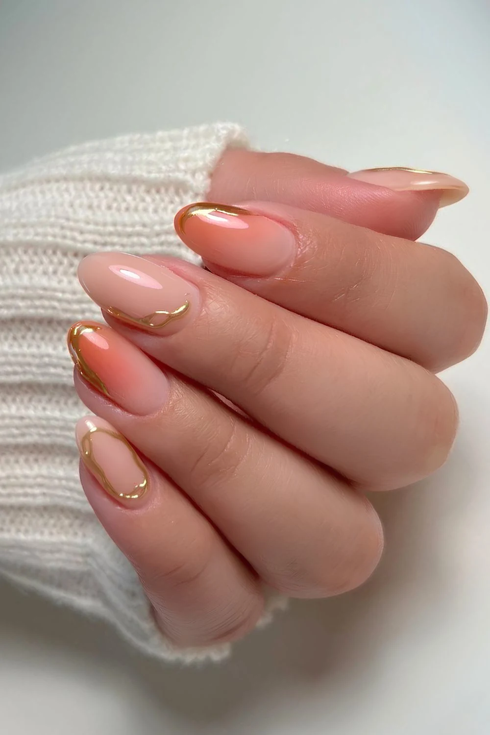 Milky nails with gold and peach accents