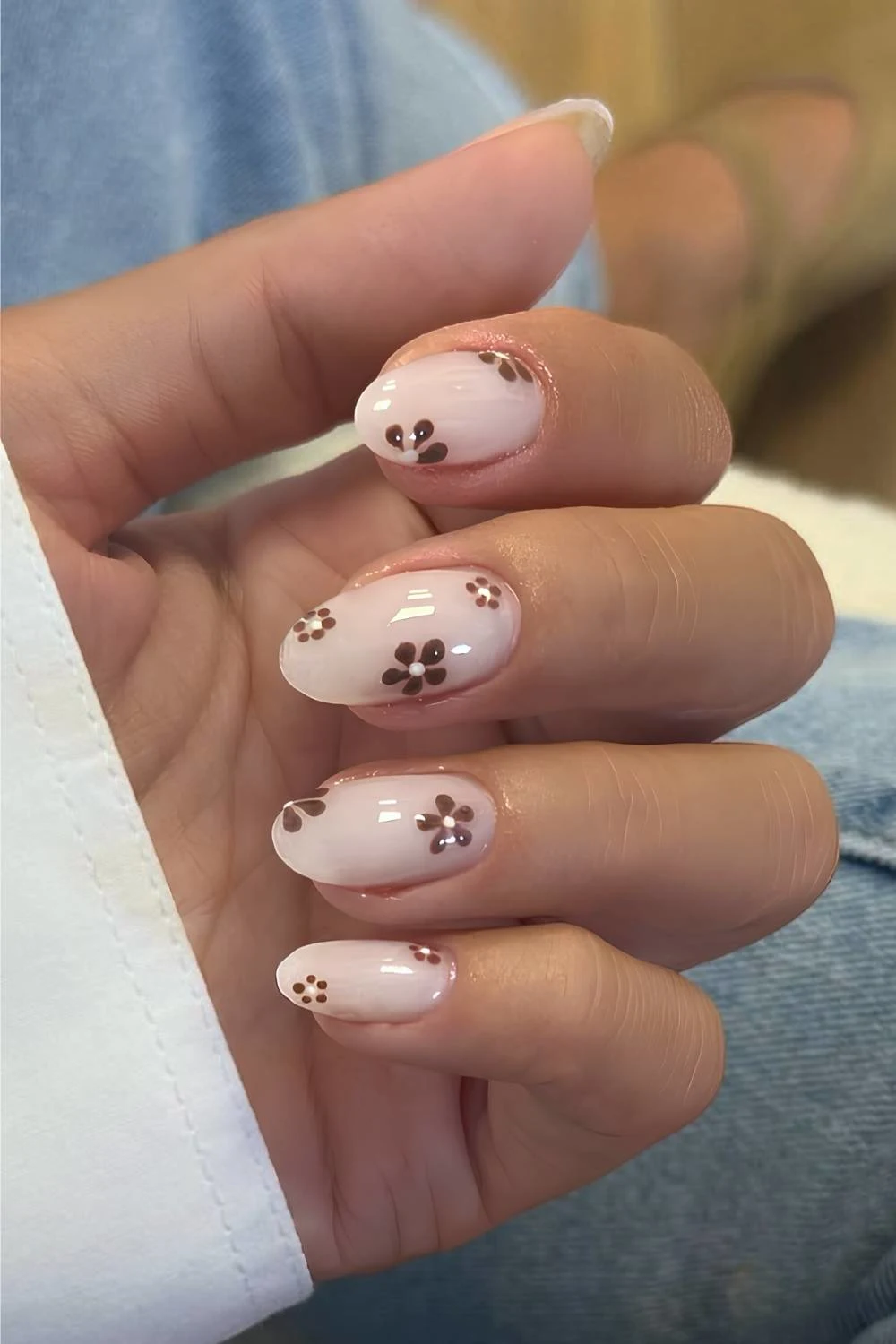 Milky white nails with brown floral art