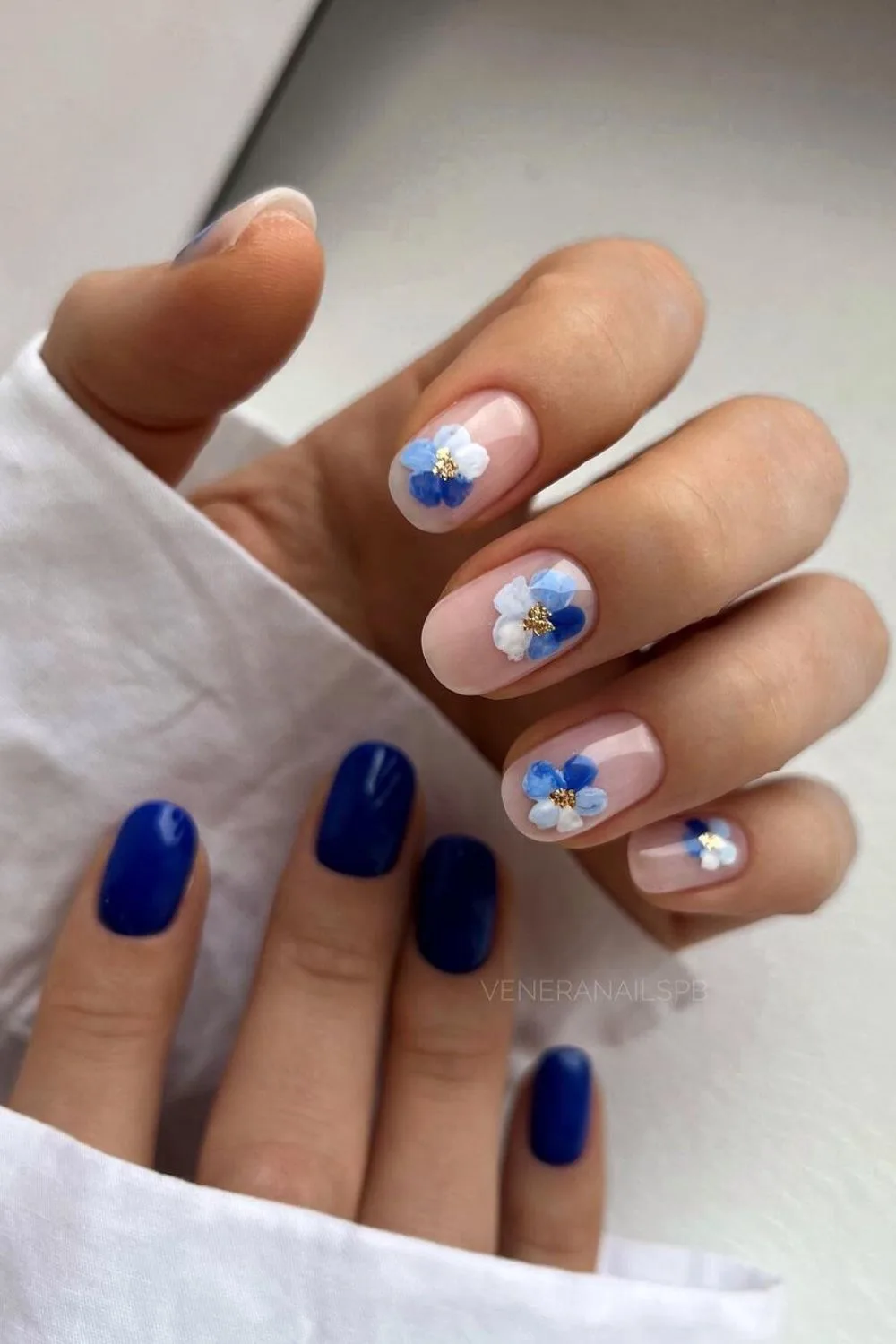 Navy blue nails with bold florals