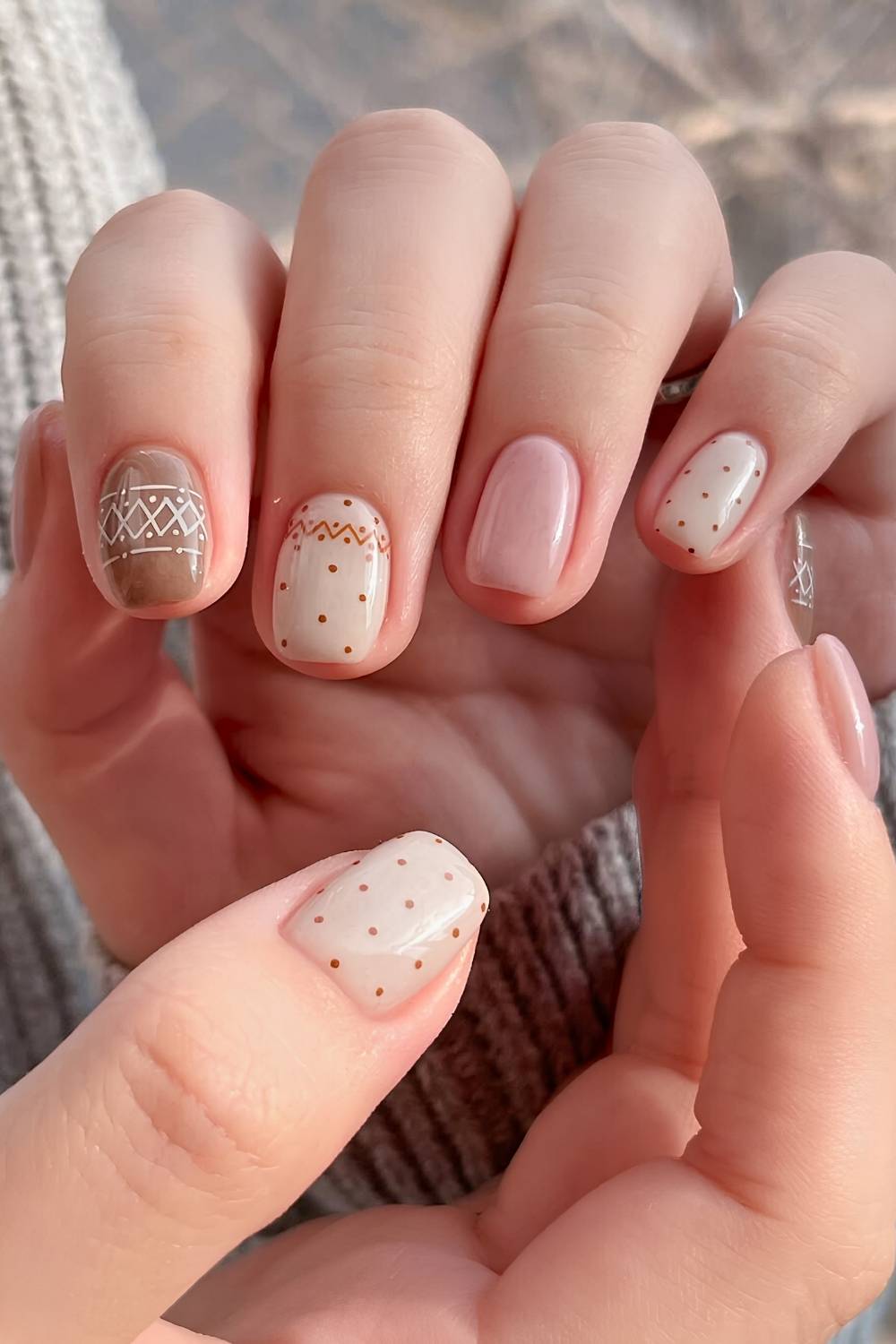 Neutral nails with Fair Isle themed art