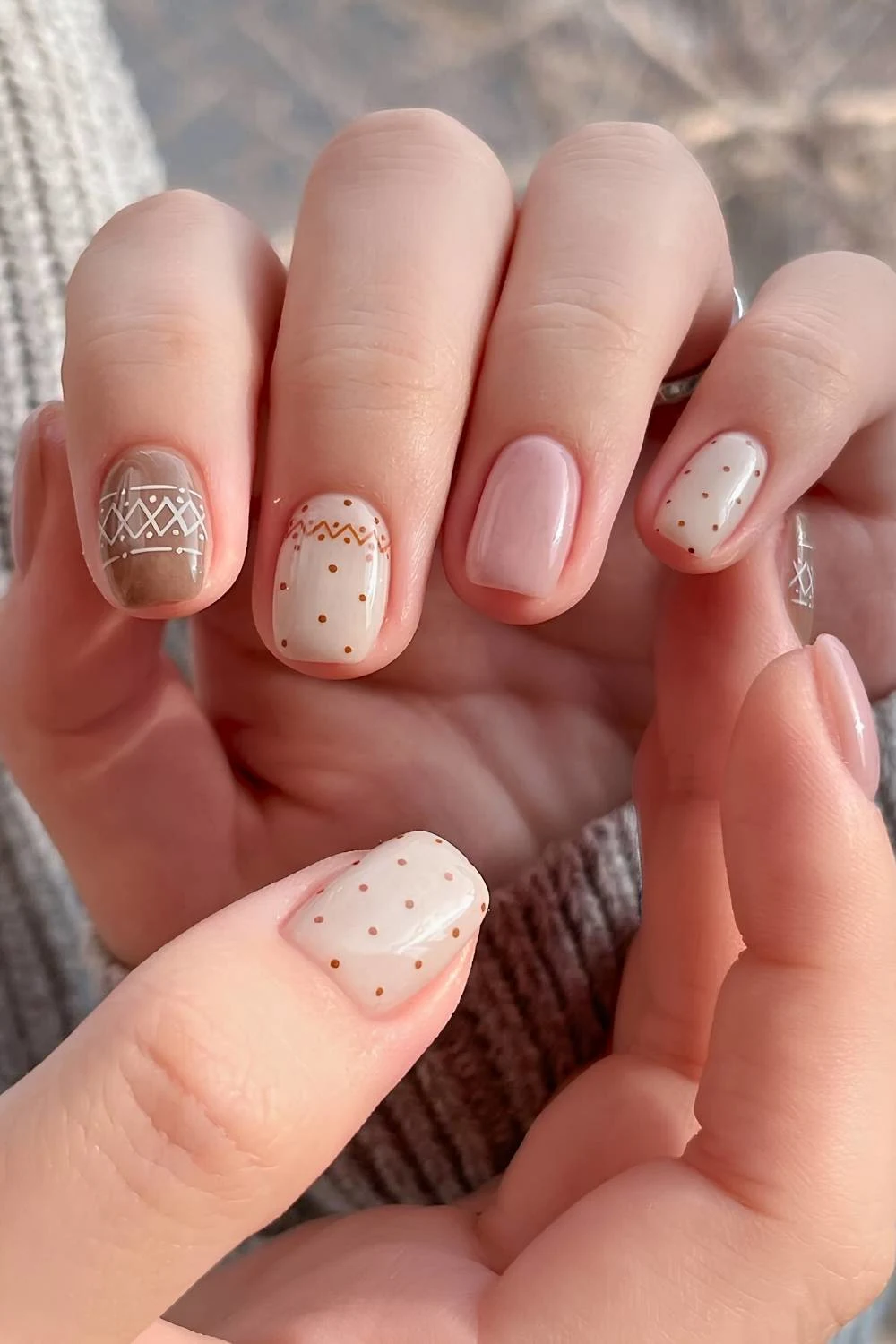 Neutral nails with Fair Isle themed art