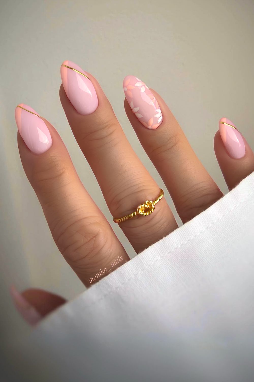 Peach French nails with flowers and gold accents