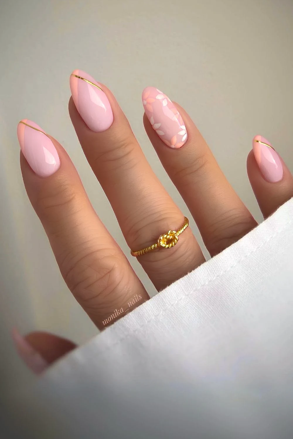Peach French nails with flowers and gold accents