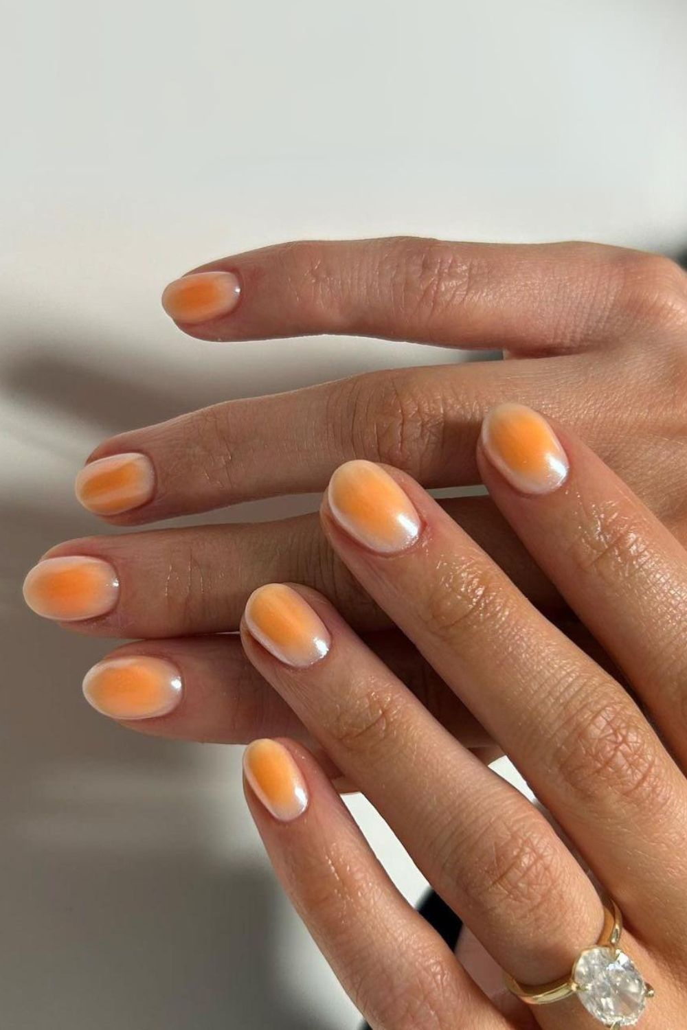 Peach aura-effect manicure