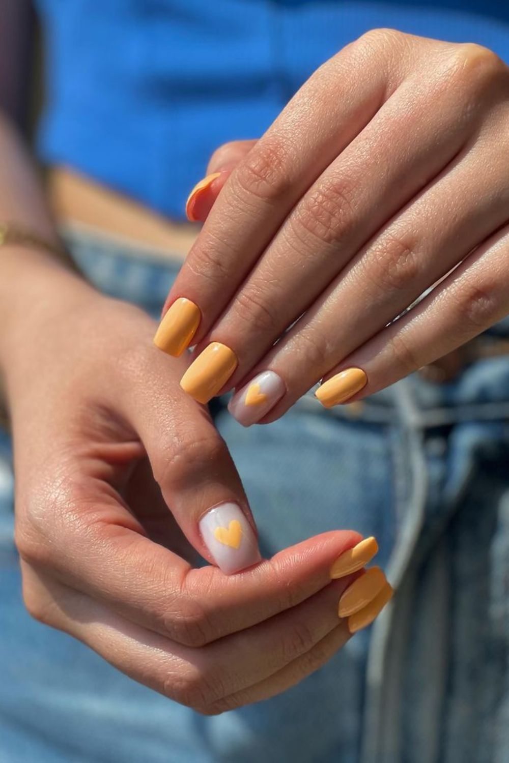 Peach nails with heart accents