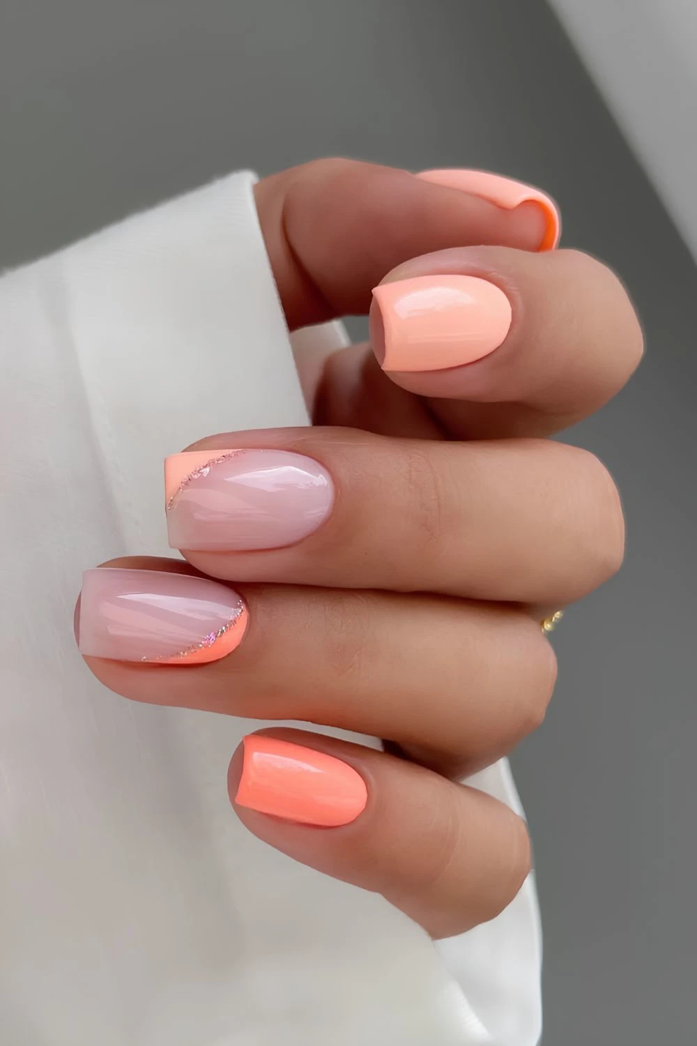 Peach nails with negative space accents