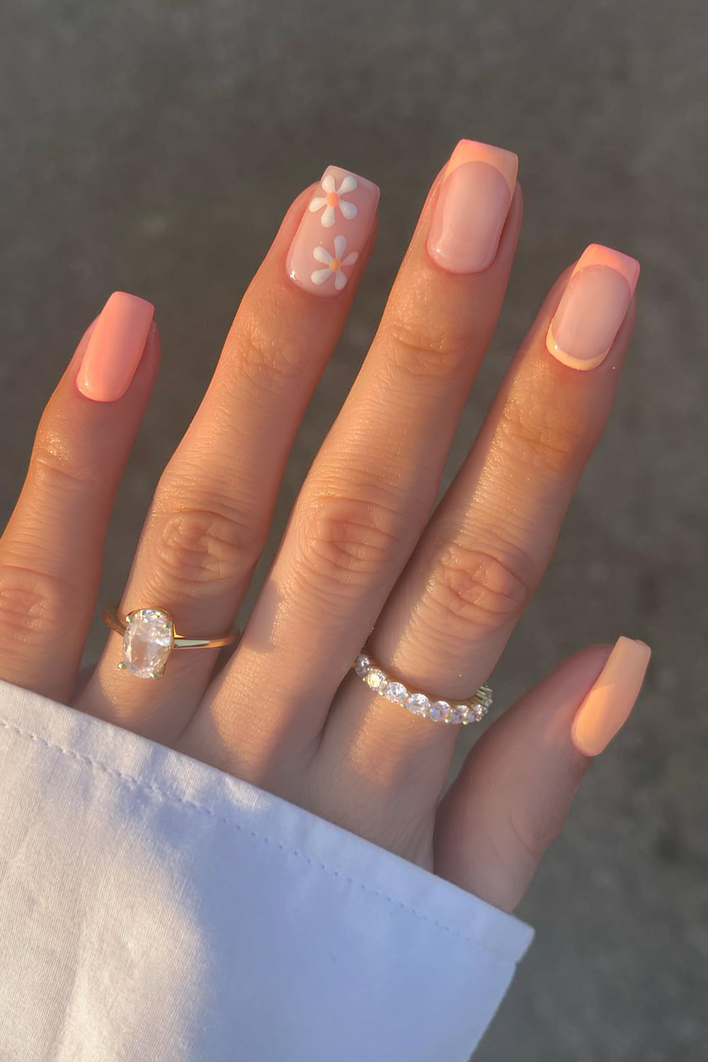Peach nails with tiny floral art