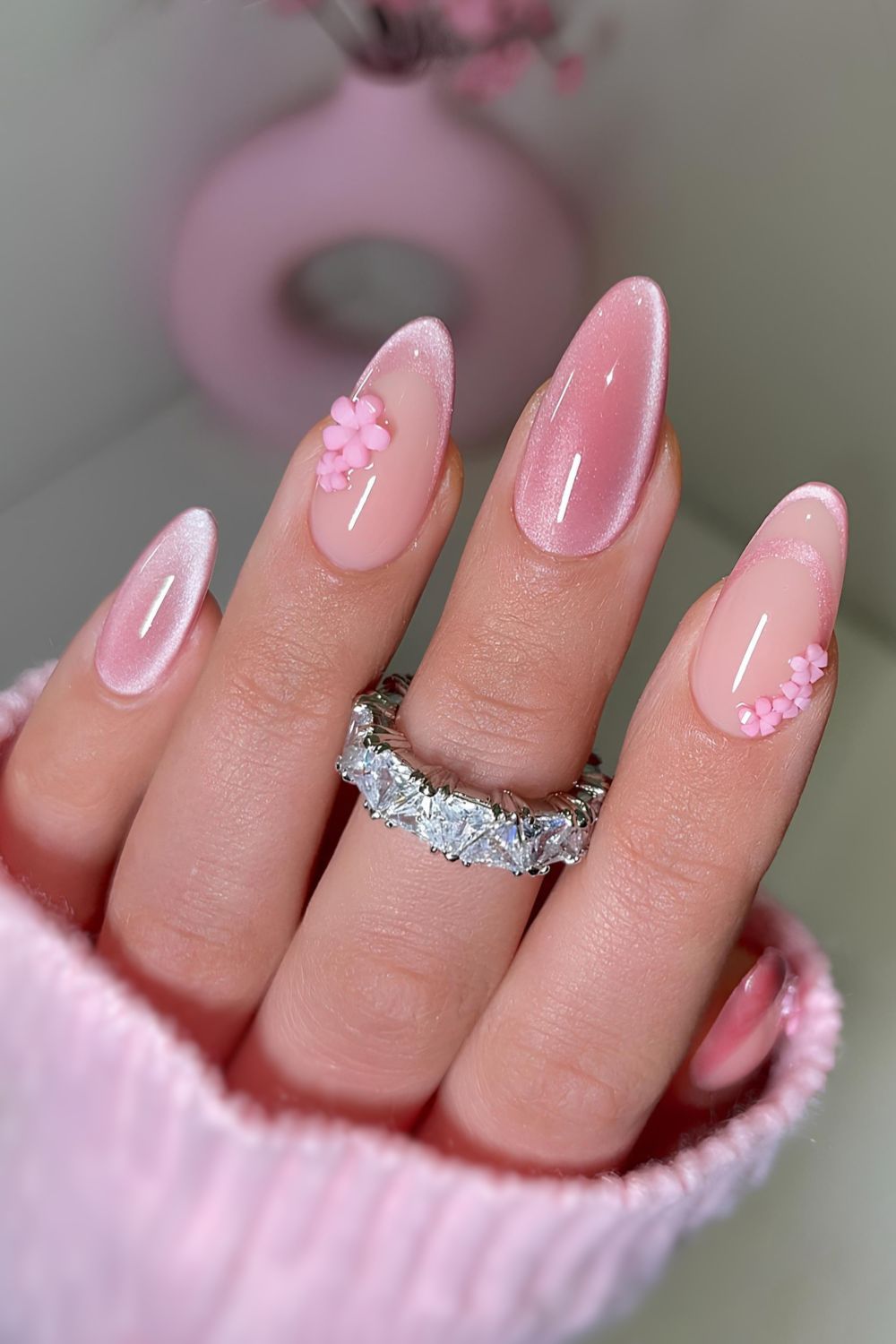 Pink cat eye nails with 3d florals