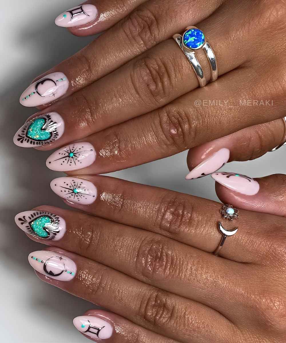Pink nails with green and silver celestial art