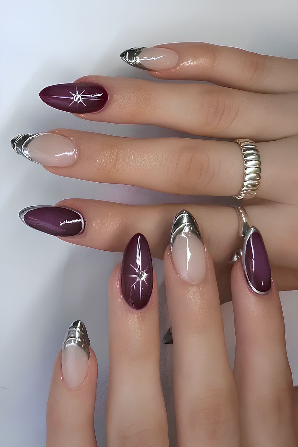 Plum nails with silver chrome accents