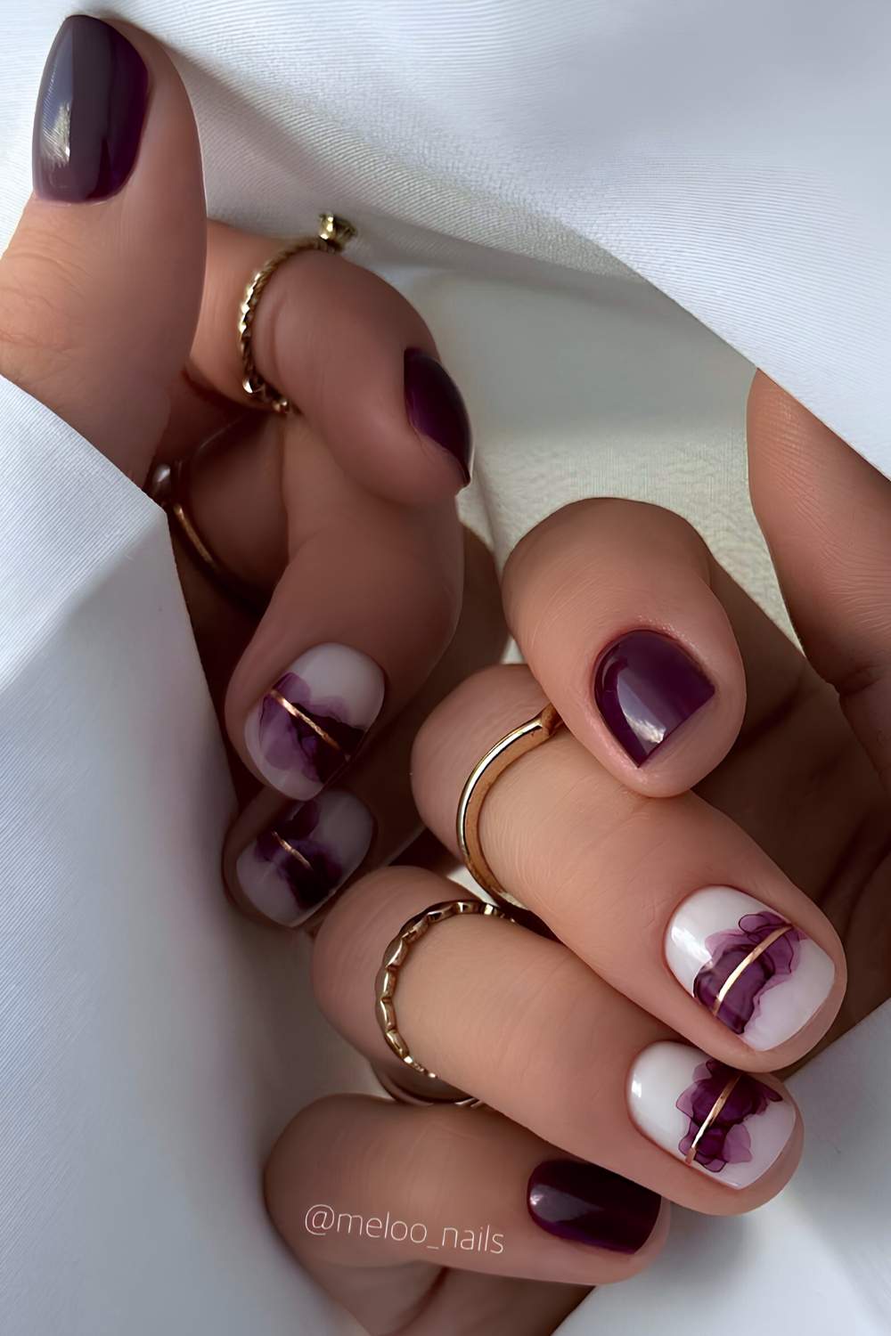 Plum nails with watercolor style art