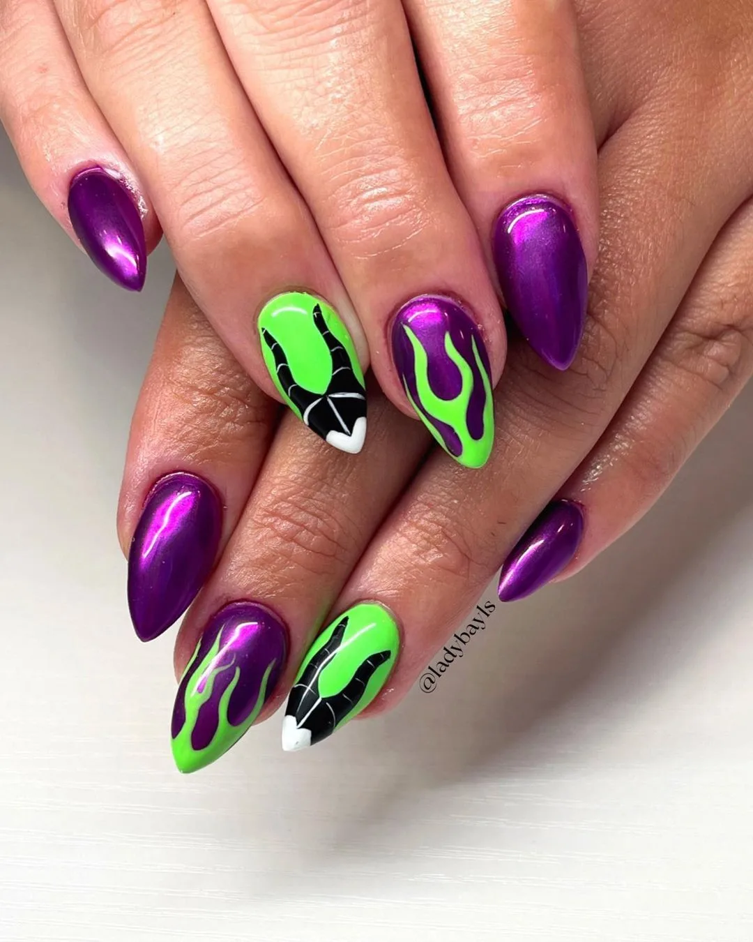 Purple and green Maleficent nails