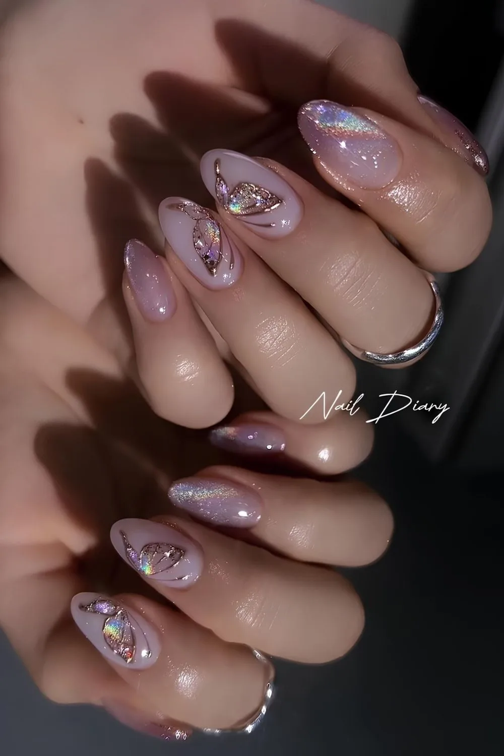 Purple and pink cat eye nails with butterflies