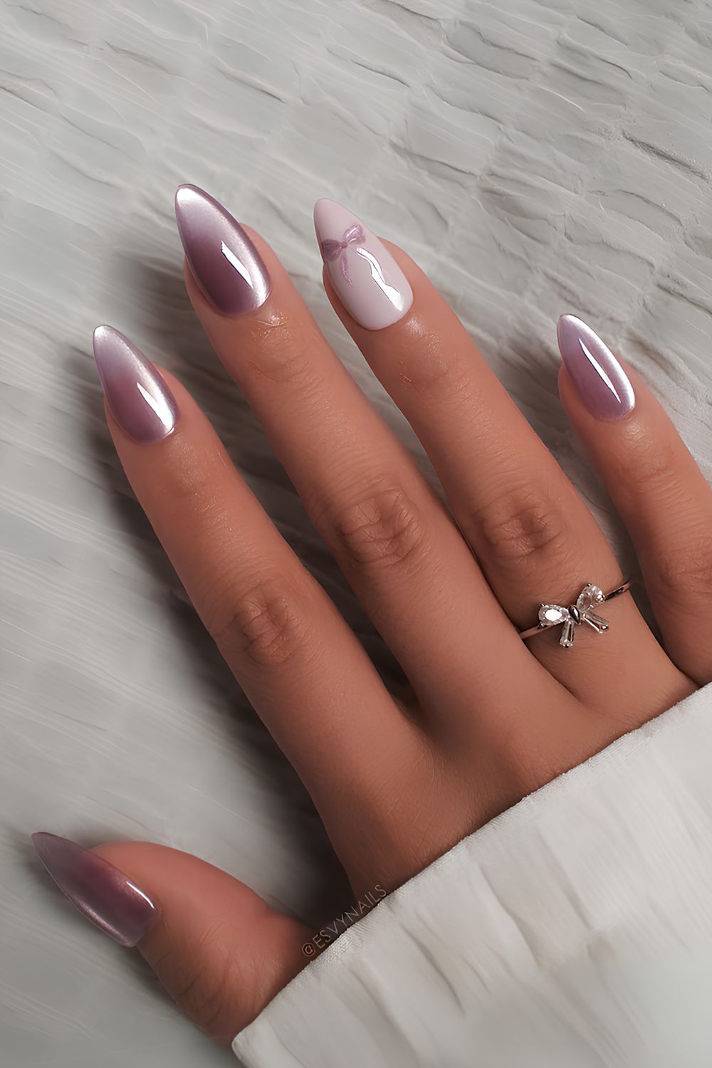 Purple and white cat eye nails