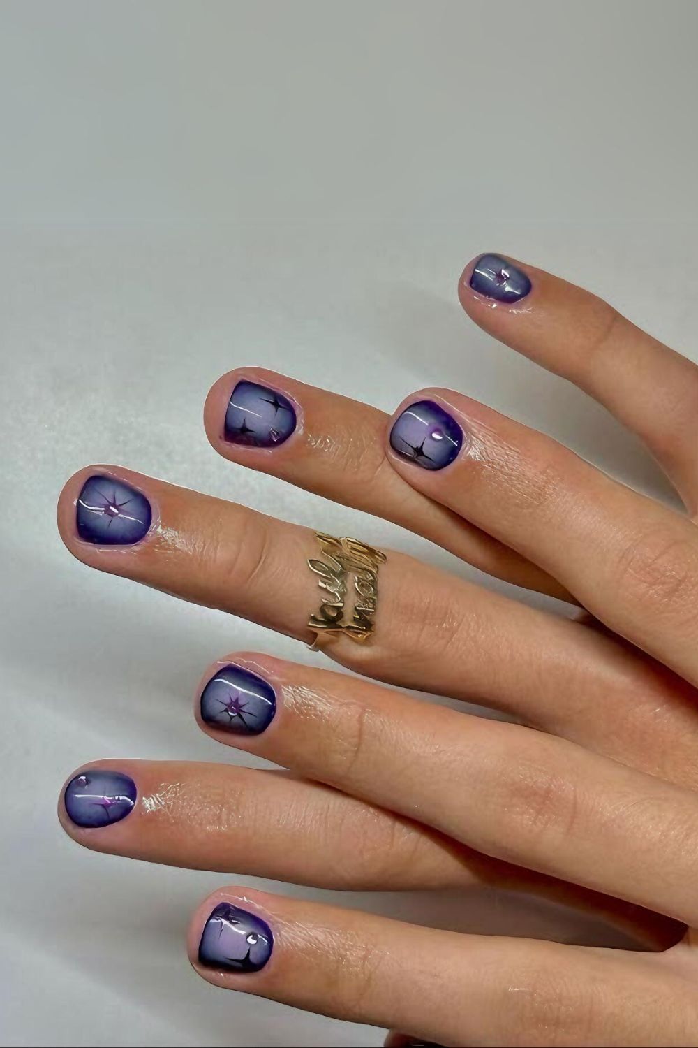 Purple aura nails with celestial charms