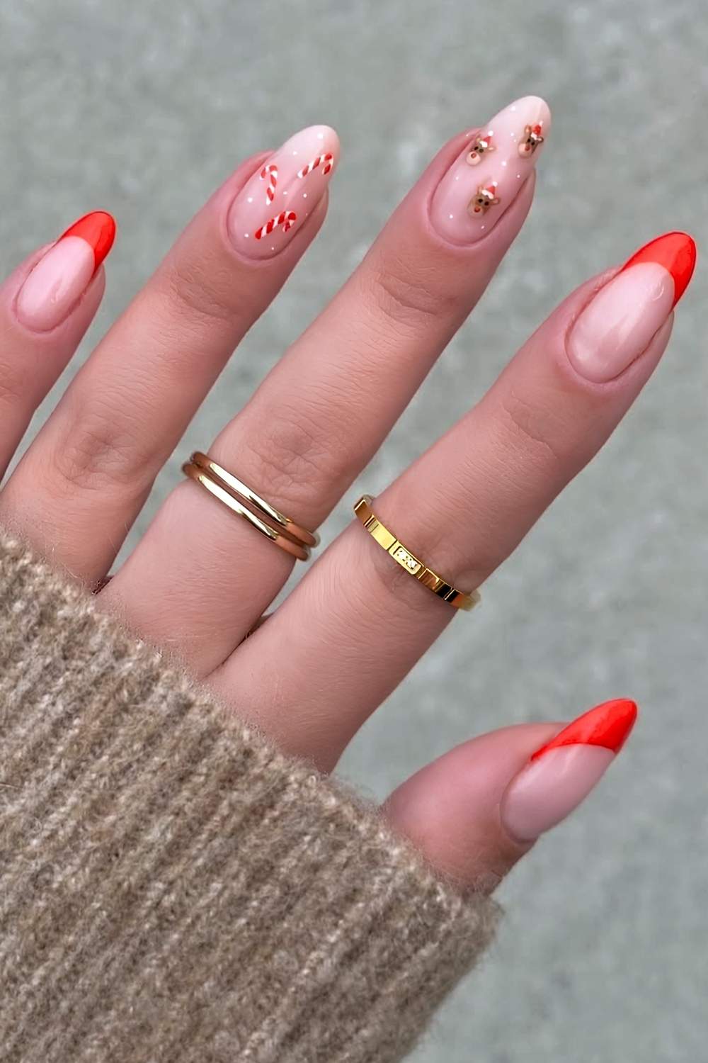 Red French mani with reindeer and candy cane art