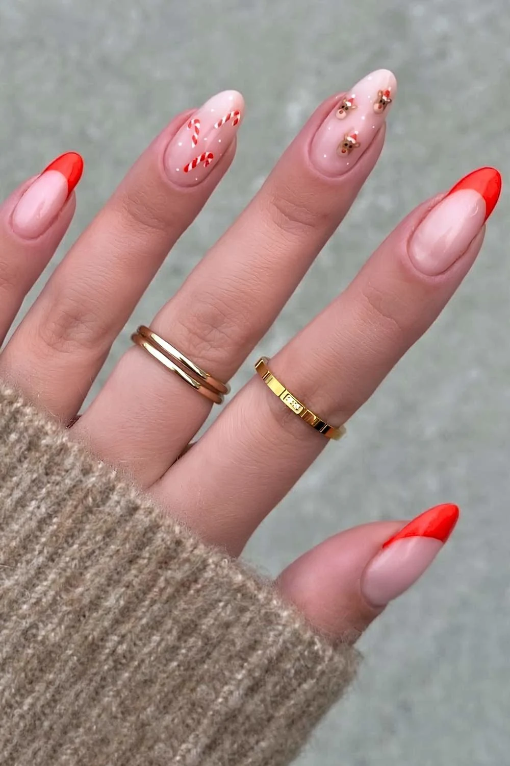 Red French mani with reindeer and candy cane art
