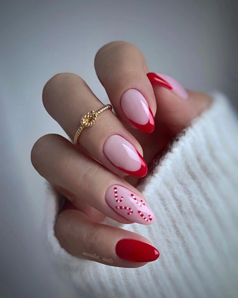 Red French tips with a candy cane design