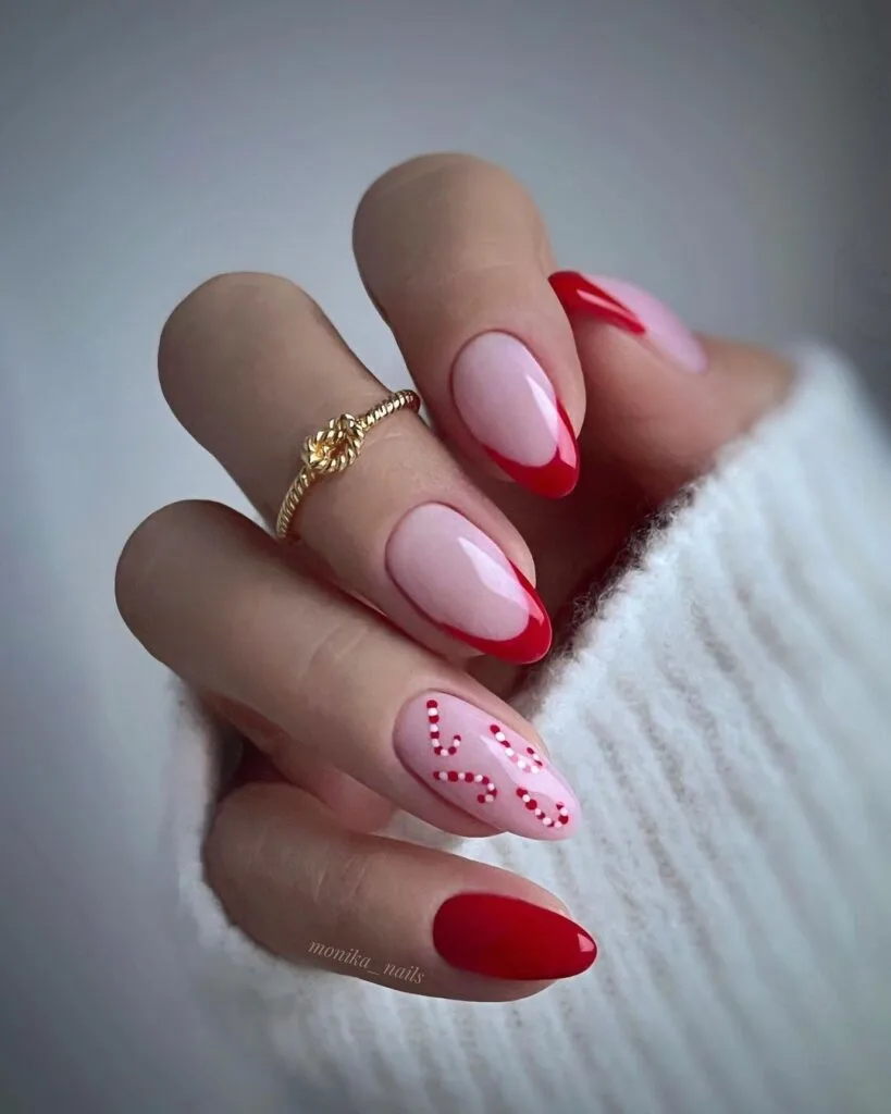 Red French tips with a candy cane design