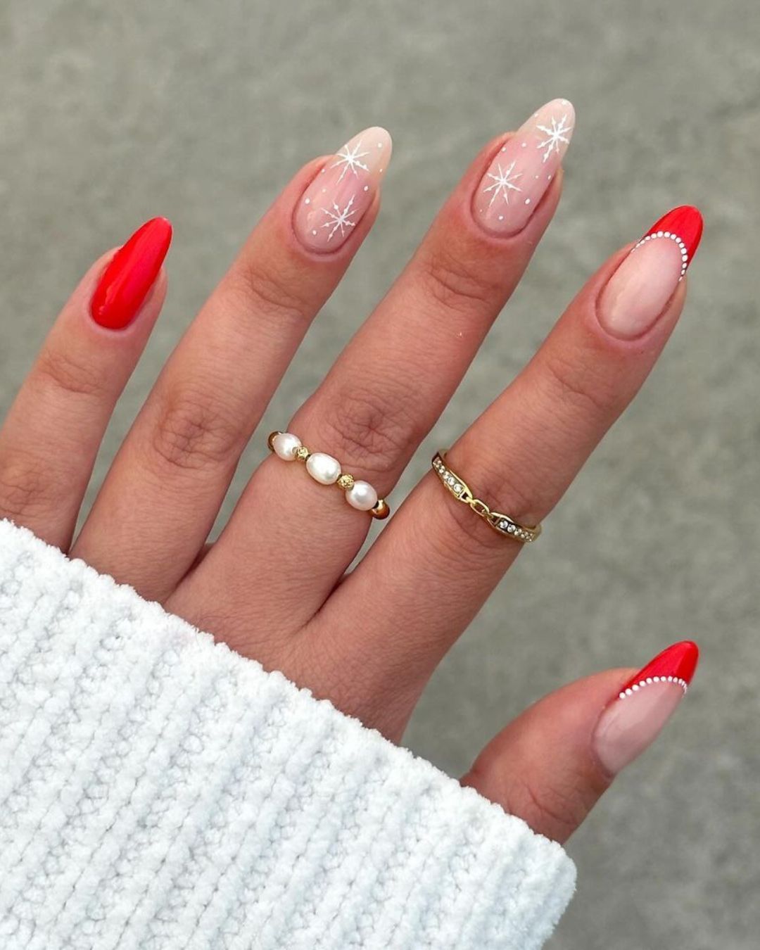 Red and nude nails with white star designs