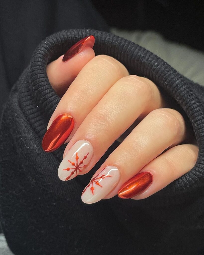 Red chrome and nude nails with red snowflake designs