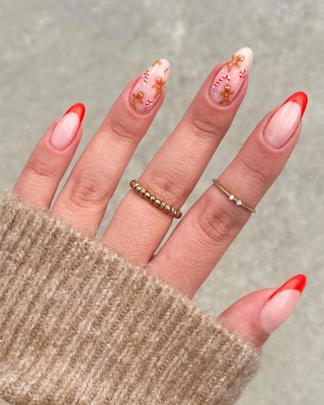 Red french mani with tiney candy canes and gingerbread cookies on accent nails